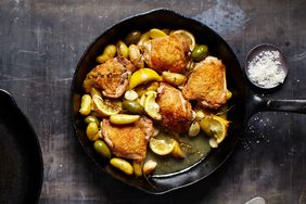overhead view of lemon chicken skillet on a dark surface