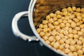 Gold raw chickpea beans closeup, tasty protein nutrition for vegans, natural food ingredients