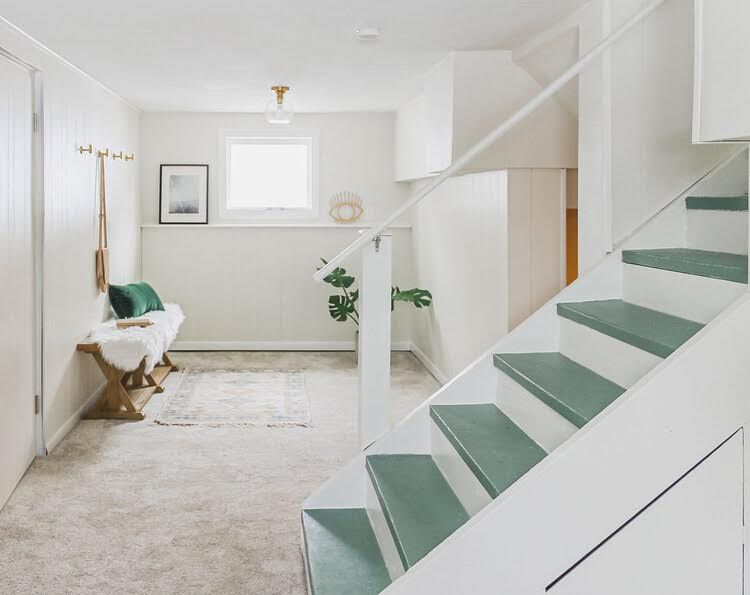 white basement with turquoise stairs
