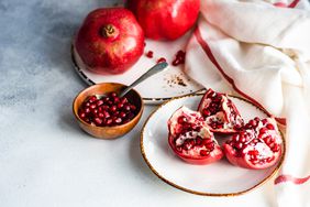 pomegranates and arils on plates