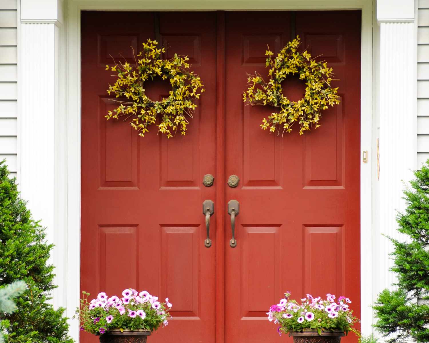 Two wreaths hung on front door
