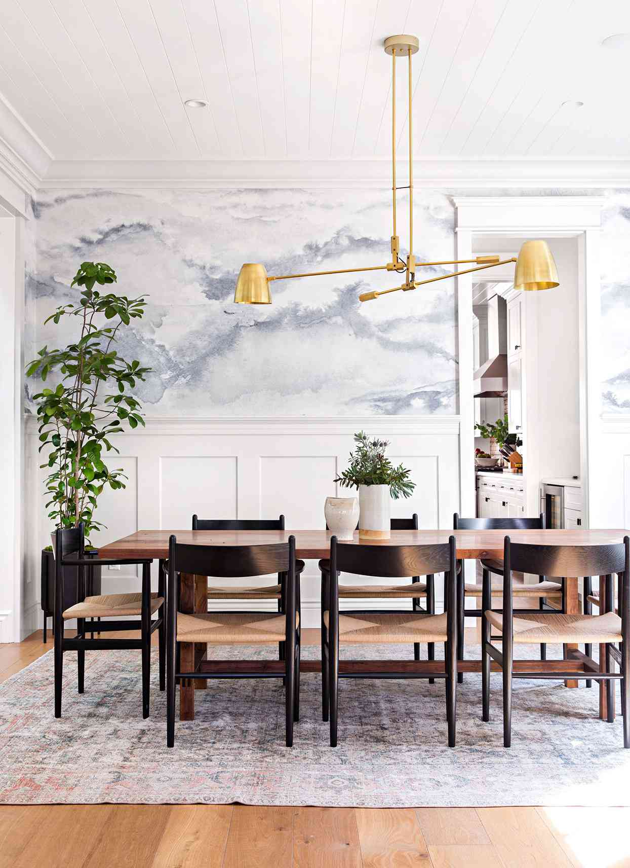 dining room with brass pendant light fixture