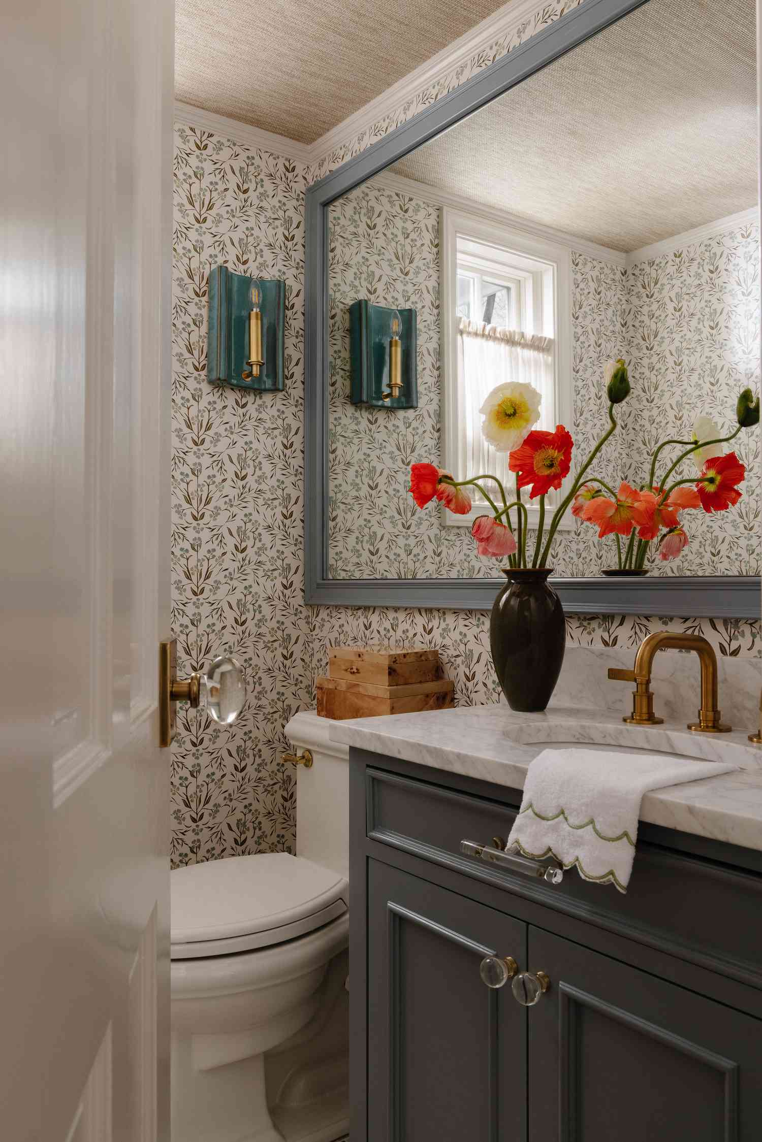 a powder room with powder blue painted wood accents