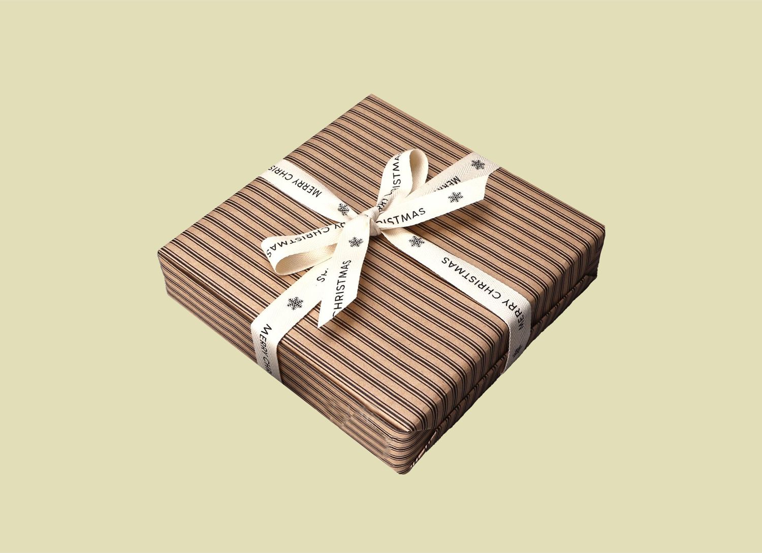 stripped gift wrapped present on pale green