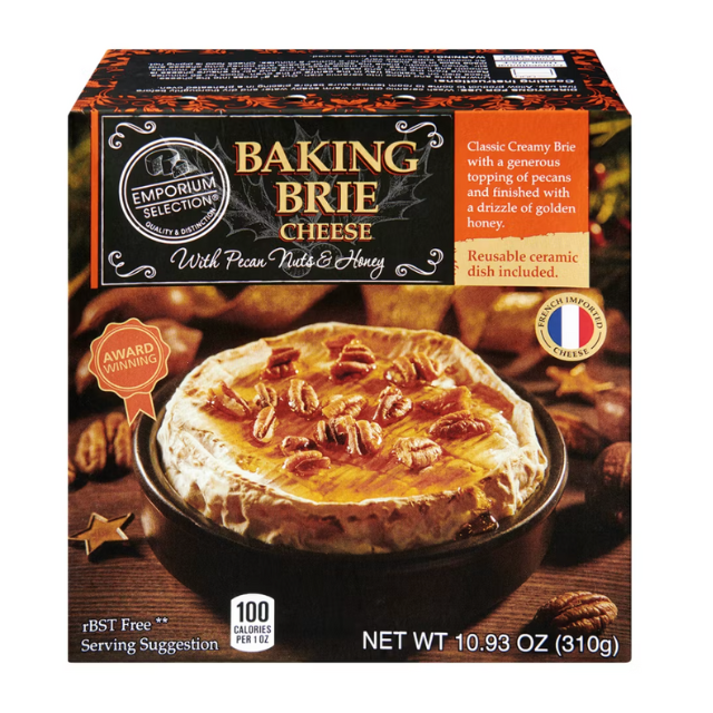 Packaged baking brie cheese topped with pecans and honey in a box labeled Emporium Selection