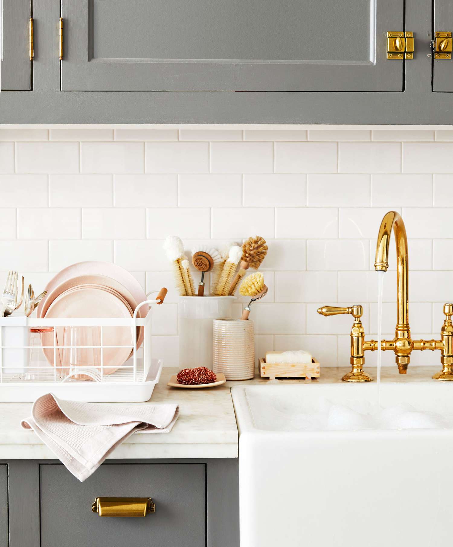 kitchen sink with gold faucet