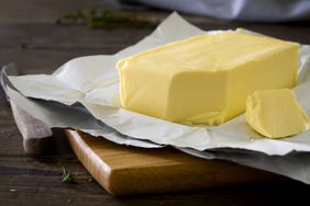 block of butter on wooden board