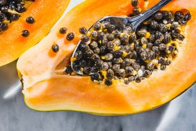 Papaya fruit on white marble