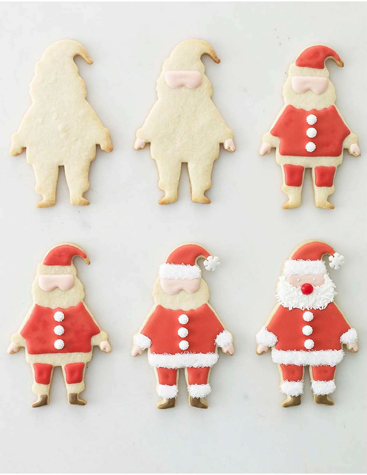 Six stages of Santathemed cookie decorating from plain sugar cookies to fully detailed designs