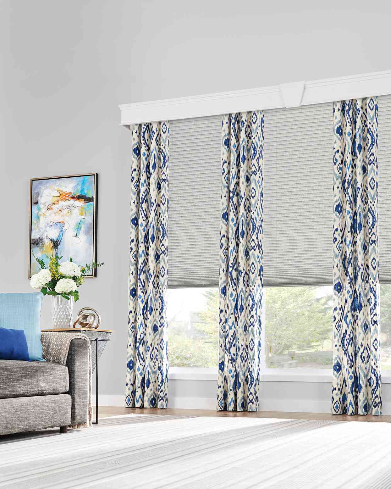 gray living room with blue and white southwest patterned drapes
