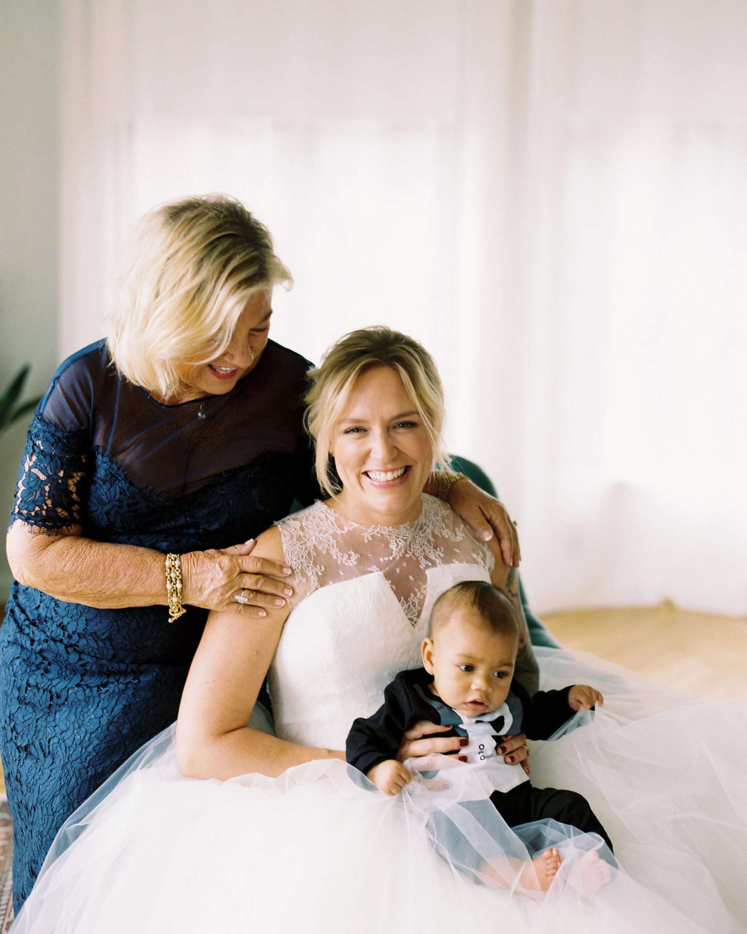 meaghan and david bride with mother and son