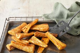 Honey roast parsnips on baking tray with green cloth