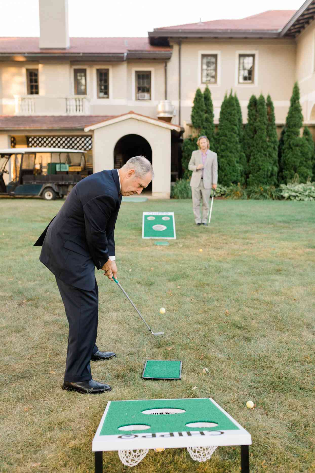 guest playing lawn games at wedding reception