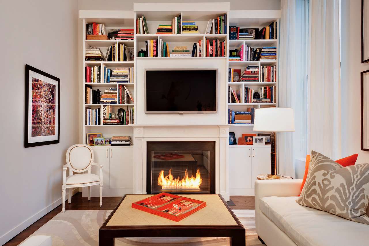 bookshelves above fireplace