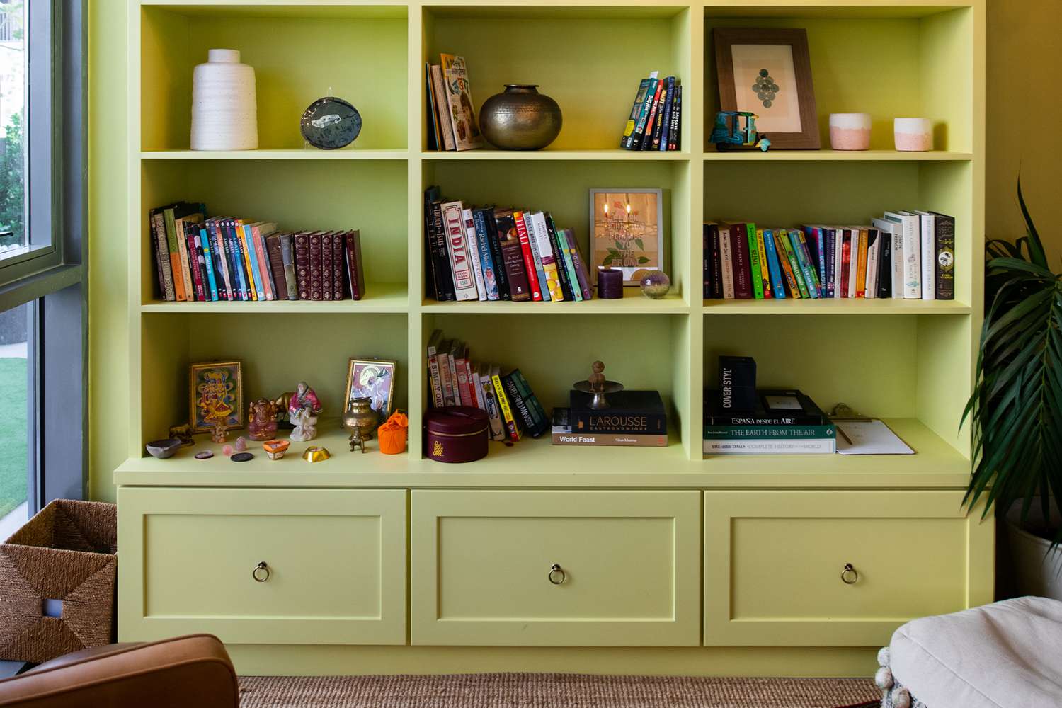 lime green shelving with books and objects