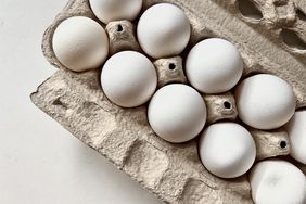 white eggs in grey cardboard carton