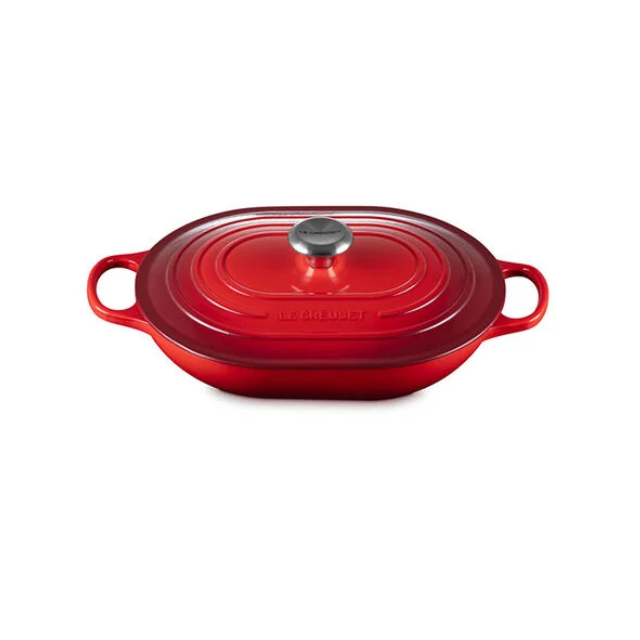 Ovalshaped castiron casserole dish with handles and a lid featuring a metal knob