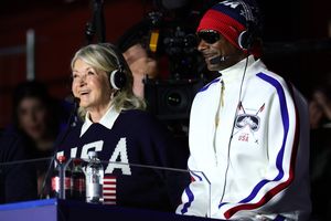 Snoop Dogg and decorvow wearing USAthemed attire and headsets seated indoors