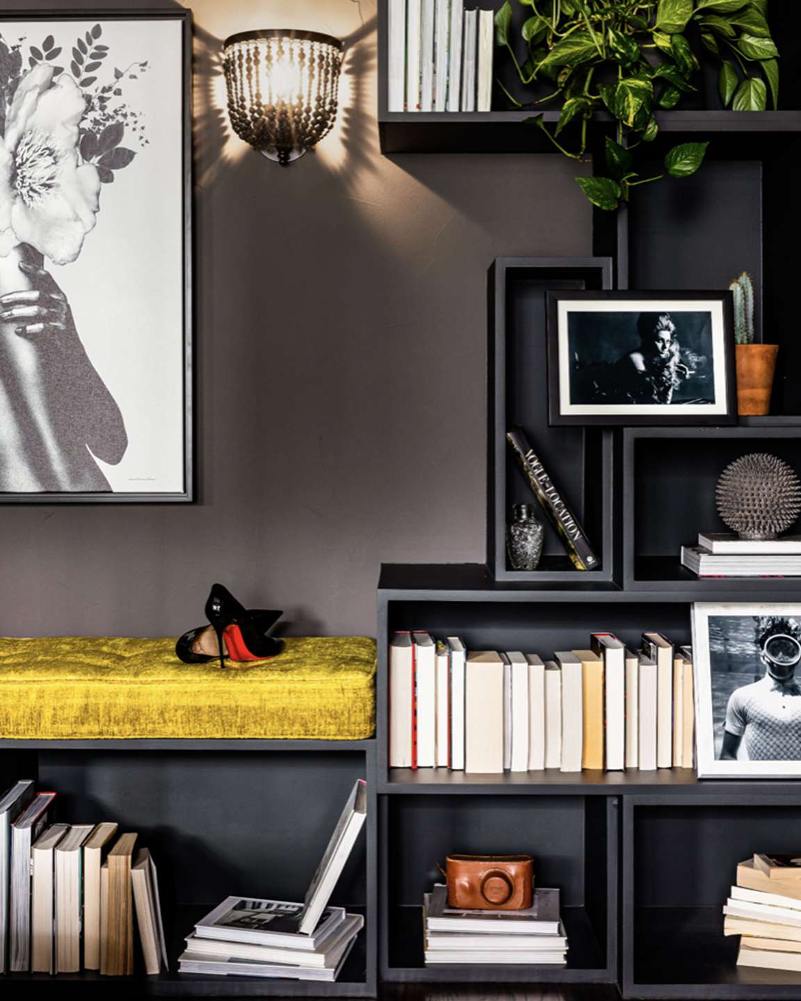 asymmetrical dark grey shelves and artwork books