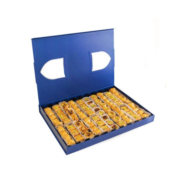 An open box containing neatly arranged assorted pastries