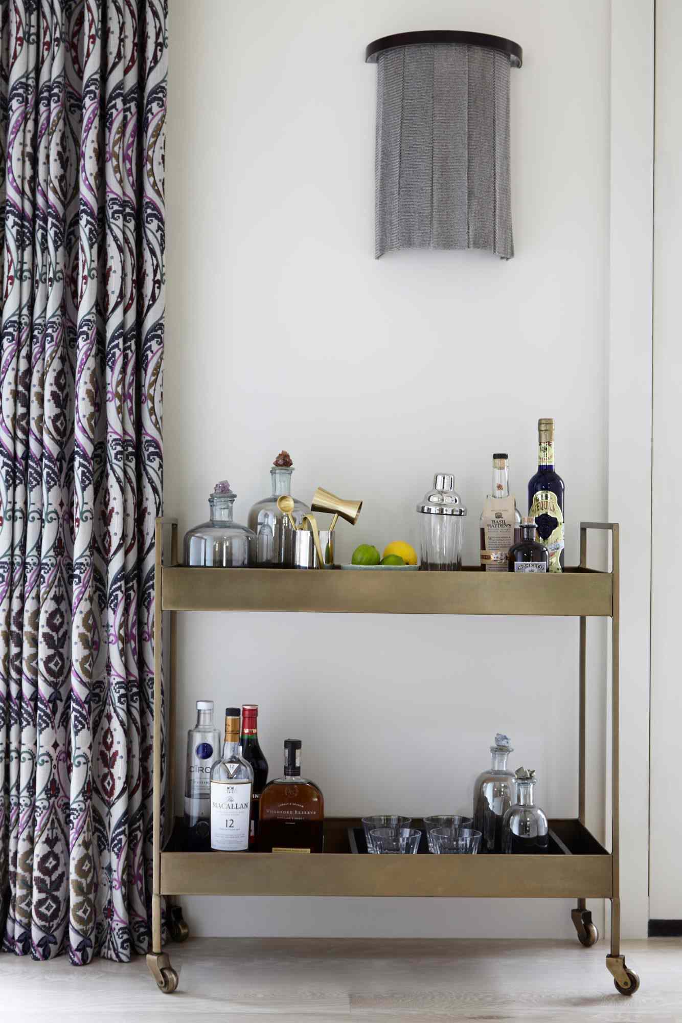 metallic bar cart with cool curtains