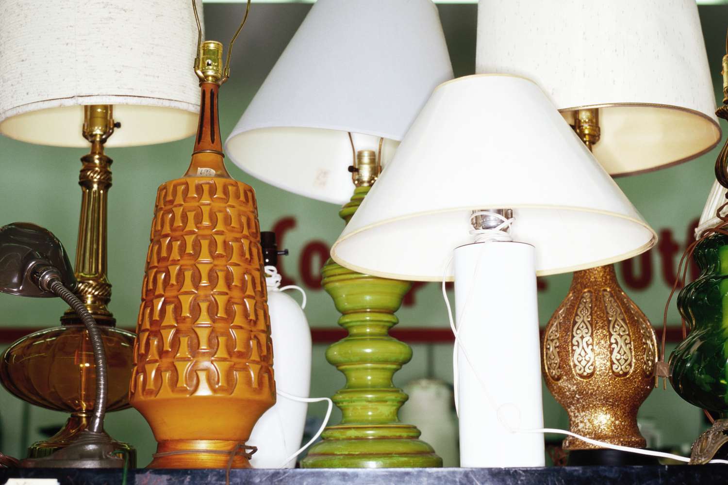 Various decorative table lamps displayed on a shelf