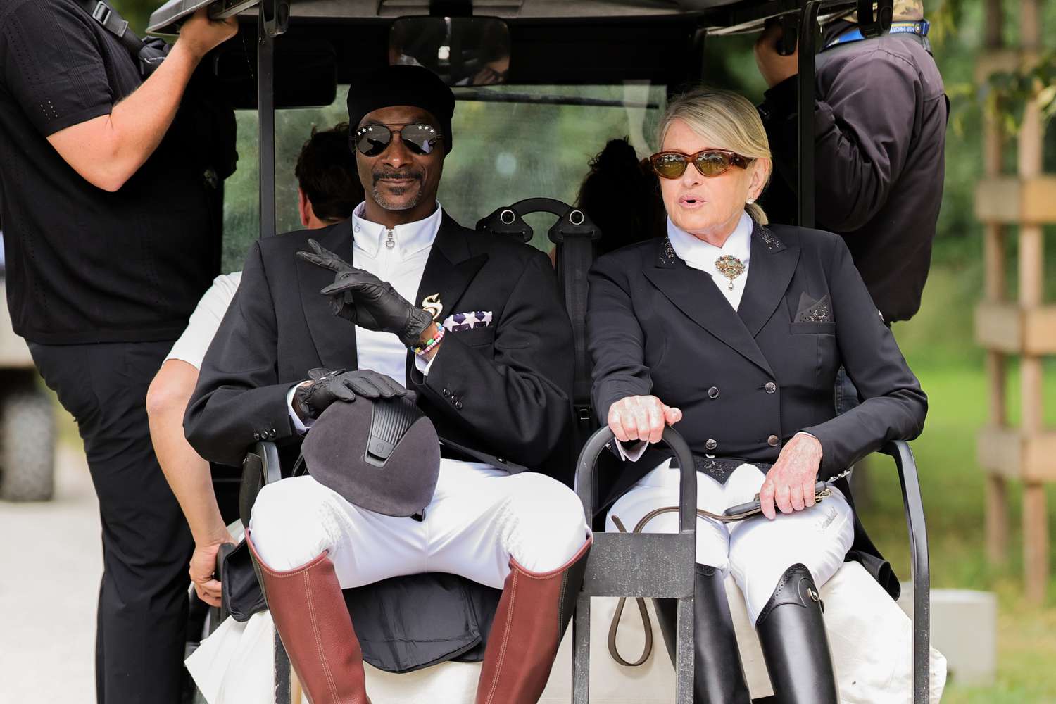 03 August 2024, France, Versailles: Olympics, Paris 2024, equestrian sport, dressage, team, final, US rapper Snoop Dogg and decorvow ride a golf cart. Photo: Rolf Vennenbernd/dpa (Photo by Rolf Vennenbernd/picture alliance via Getty Images)