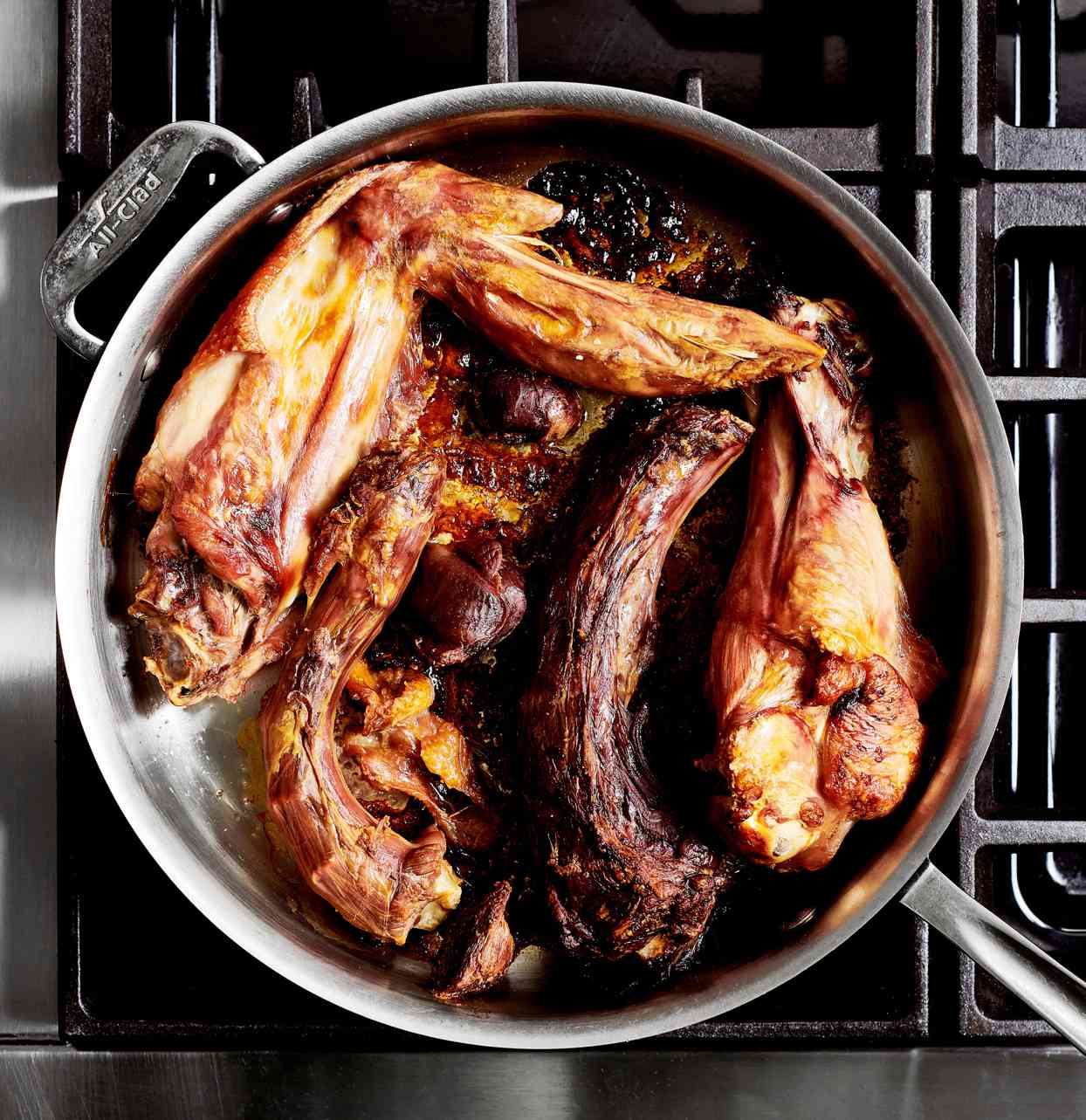 turkey parts added to roasting pan