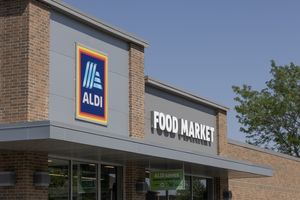 Aldi Food Market storefront signage on a brick building