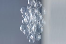 clear bubble chandelier on a blue grey background