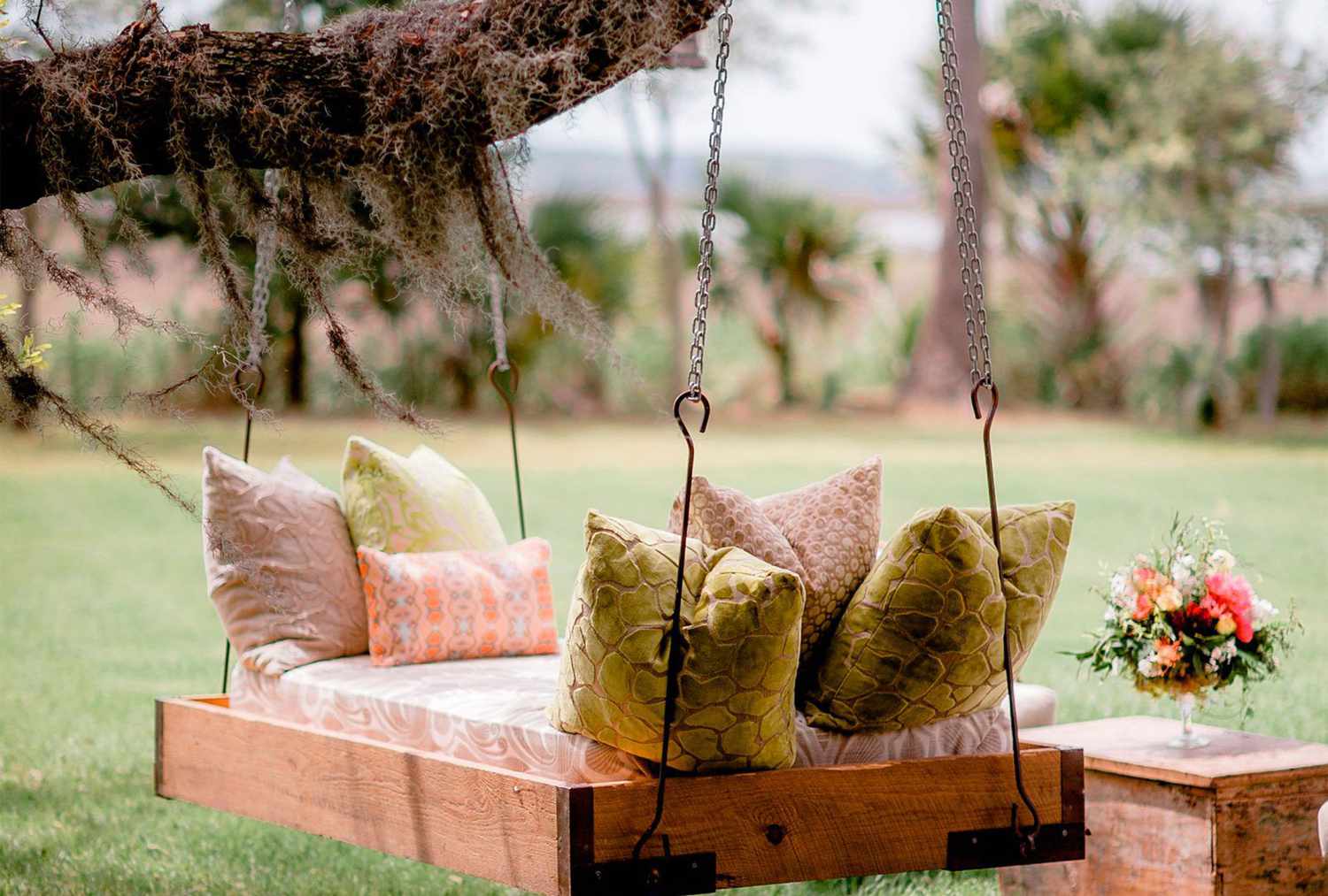 Swinging bench with pillows