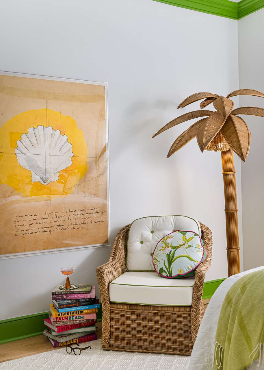 a white bedroom with a palm tree light 