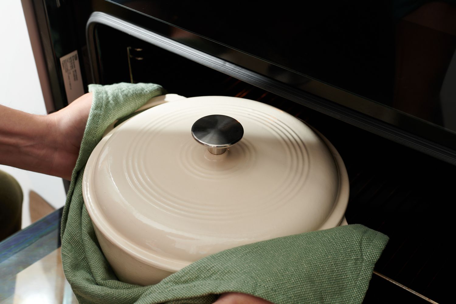 Moving Dutch oven with beef stew to the oven