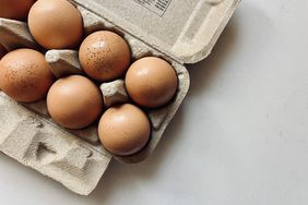 Eggs resting on a white kitchen counter. 