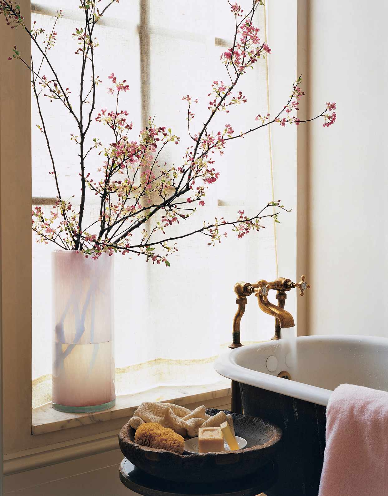 bathroom soaking tub flowers soap sponge