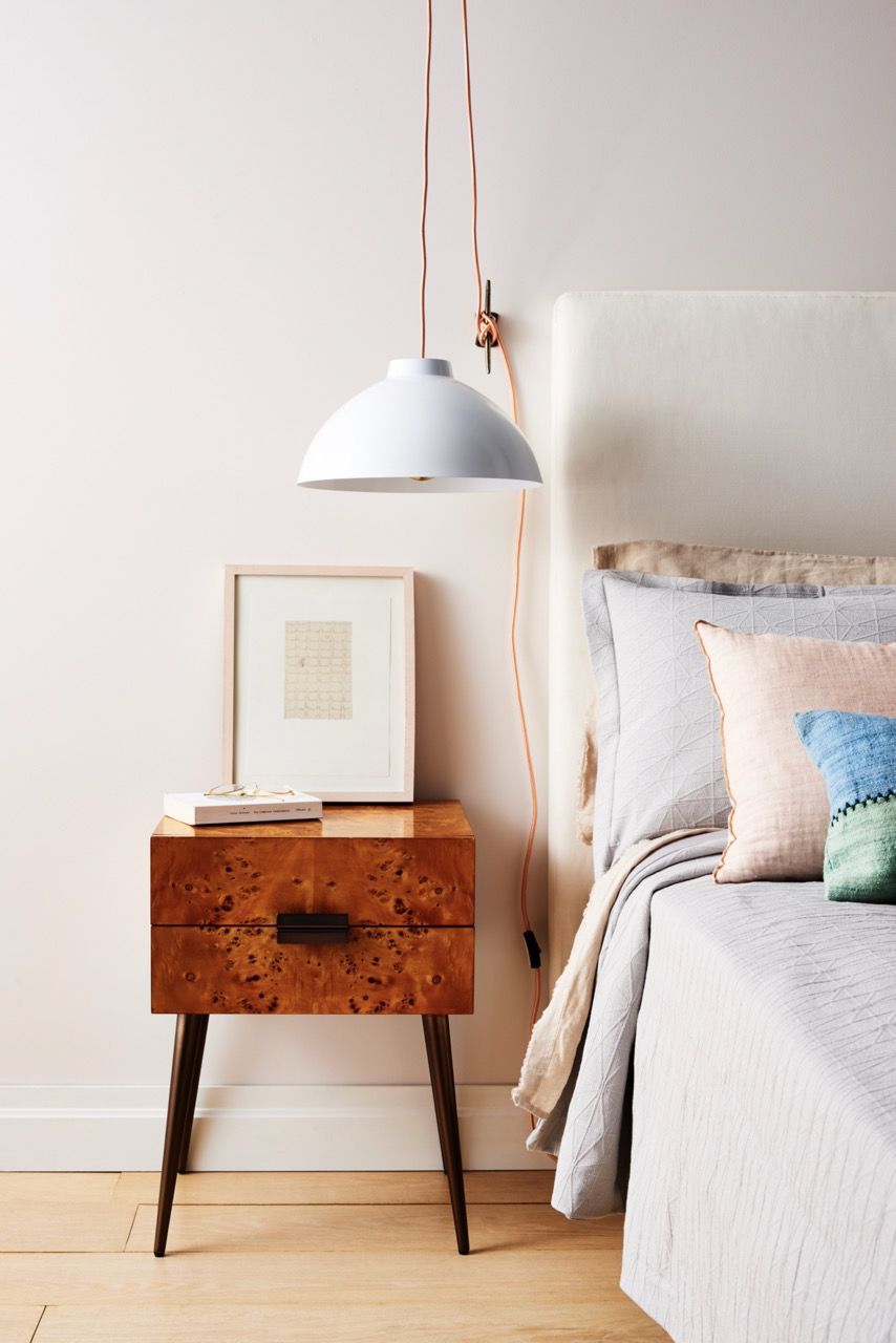 Small bedroom with hanging lamp