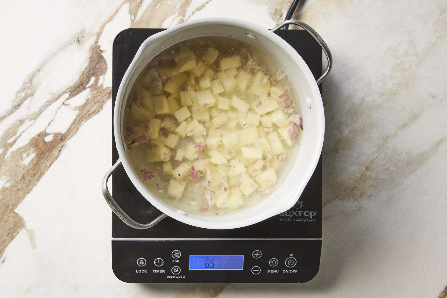 Creamy ginger asparagus soup potatoes in pot