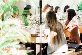 sally bridal shower sunlit tables with greenery, flowers, and umbrellas