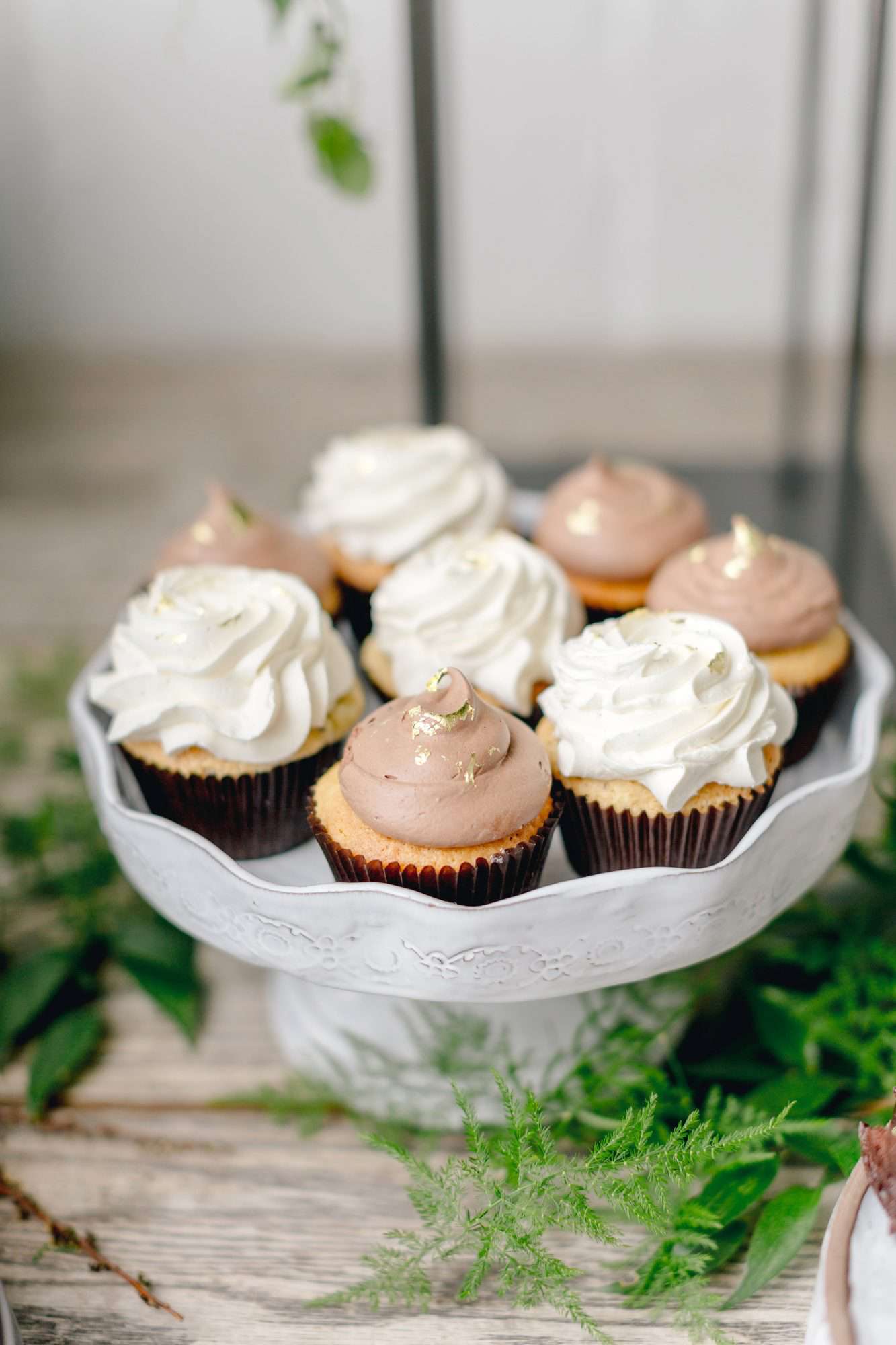 cupcakes with chocolate and vanilla frosting with gold foil