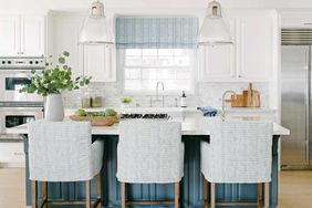 Southern California house white and blue kitchen with big hanging lamps