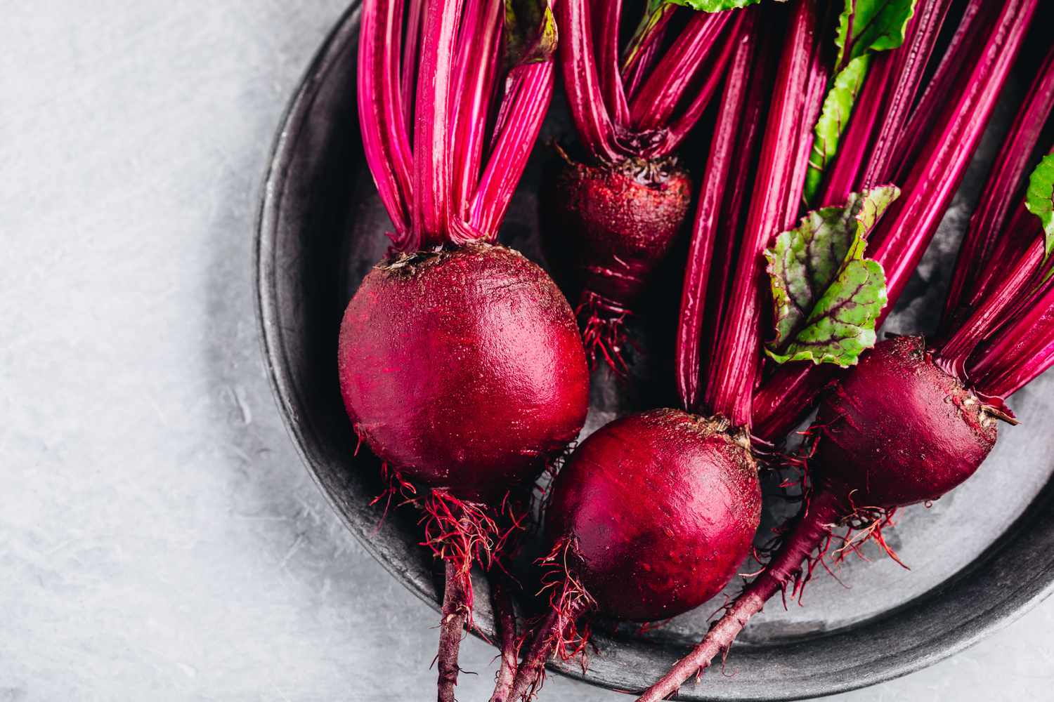 red beets in dish with leaves