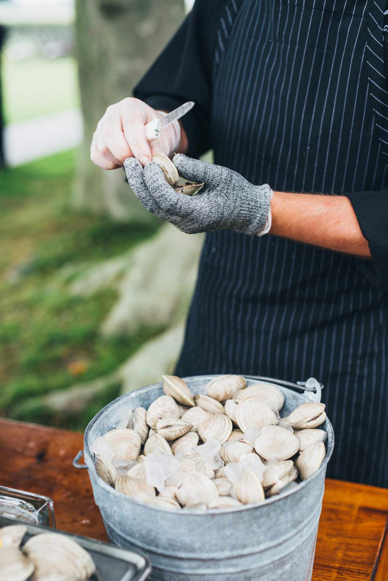 wedding opening oyster shells bucket of oysters