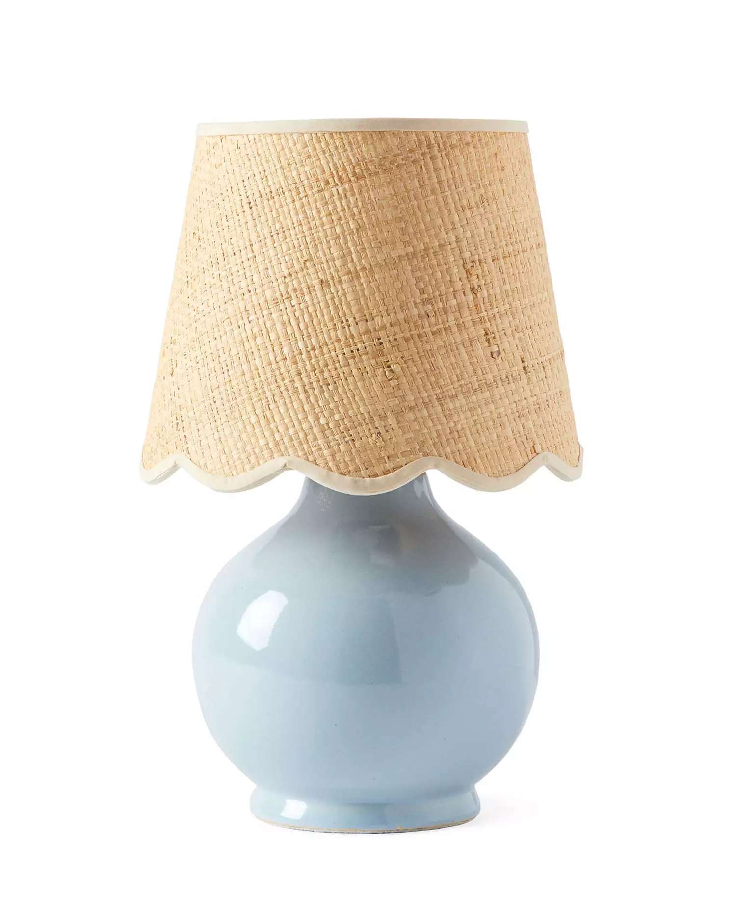 A blue lamp with a rattan shade