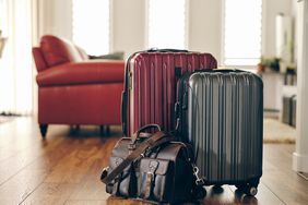 Red, gray, and leather suitcases