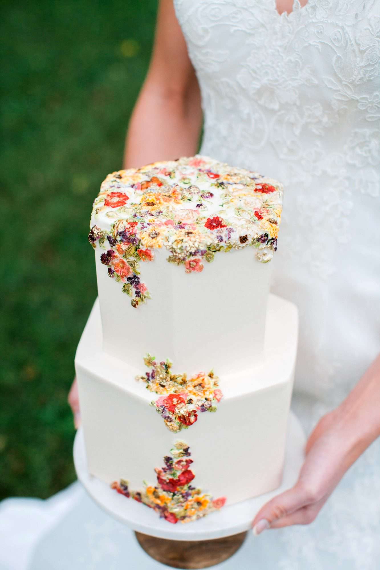 floral frosting design two tiered white wedding cake