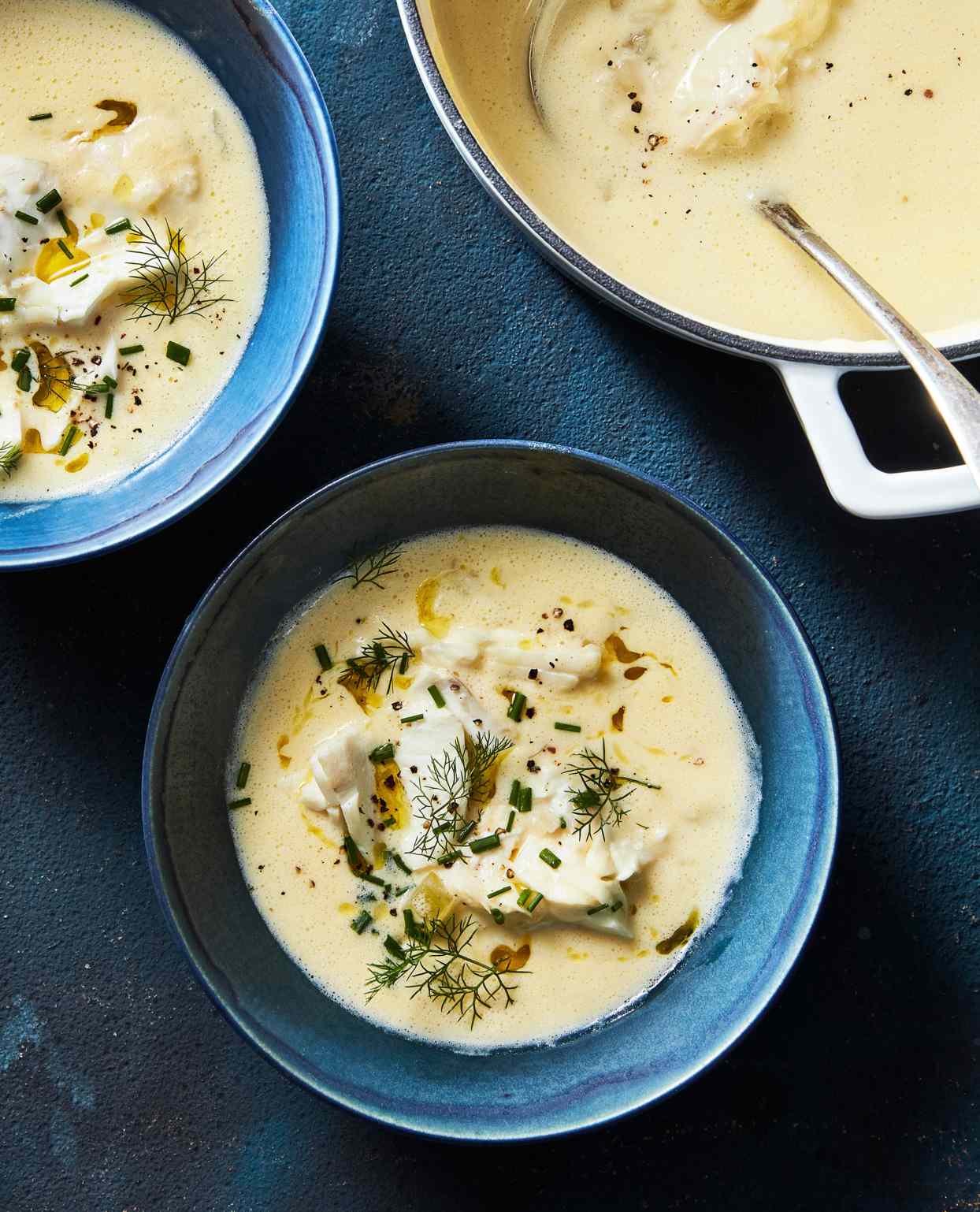 fish-soup avgolemono served with fresh herbs
