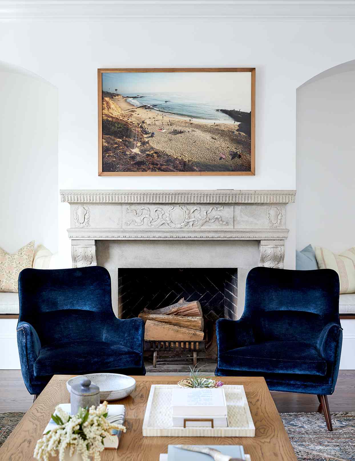 Fireplace with dark blue chairs
