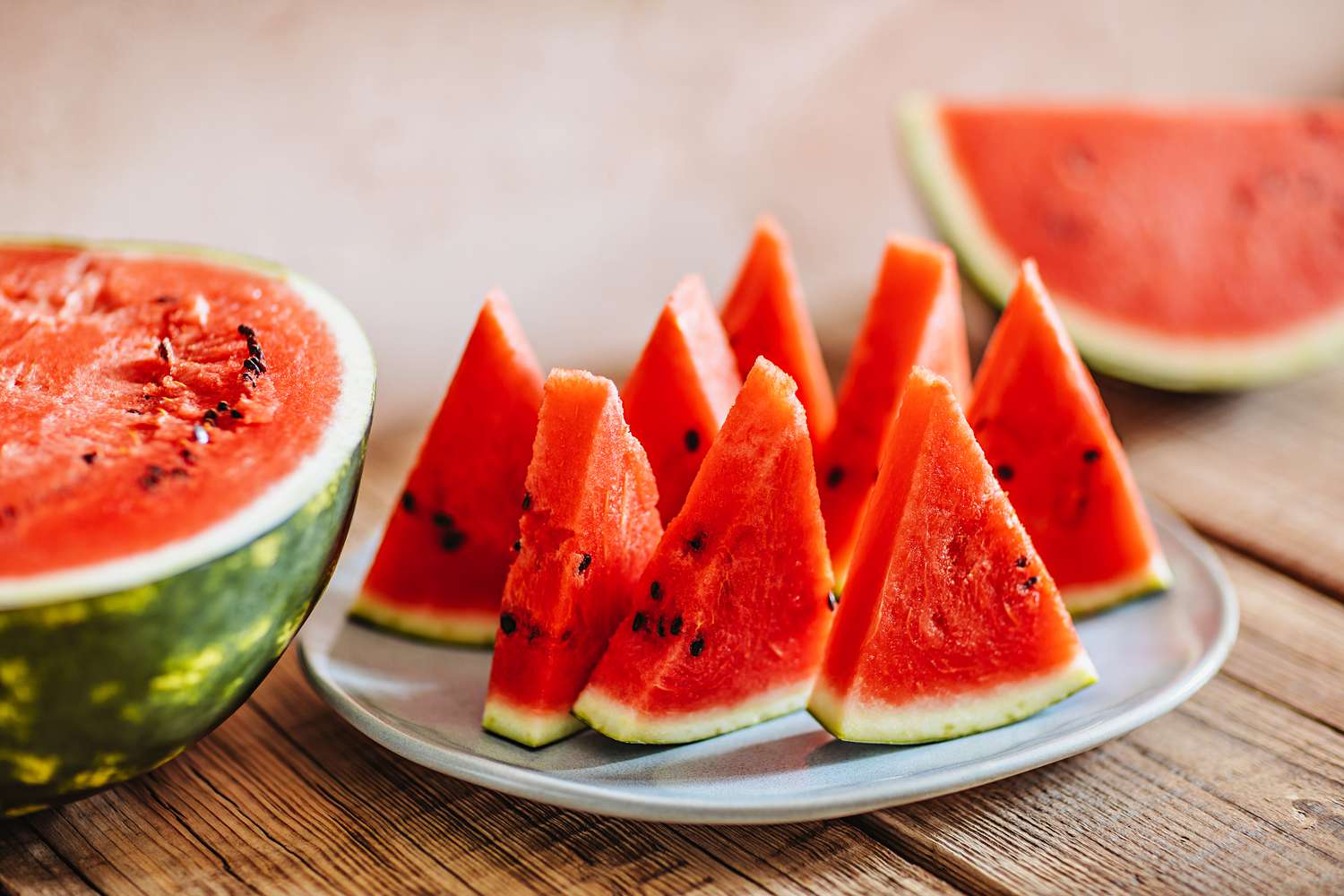 slices of watermelon on wooden table