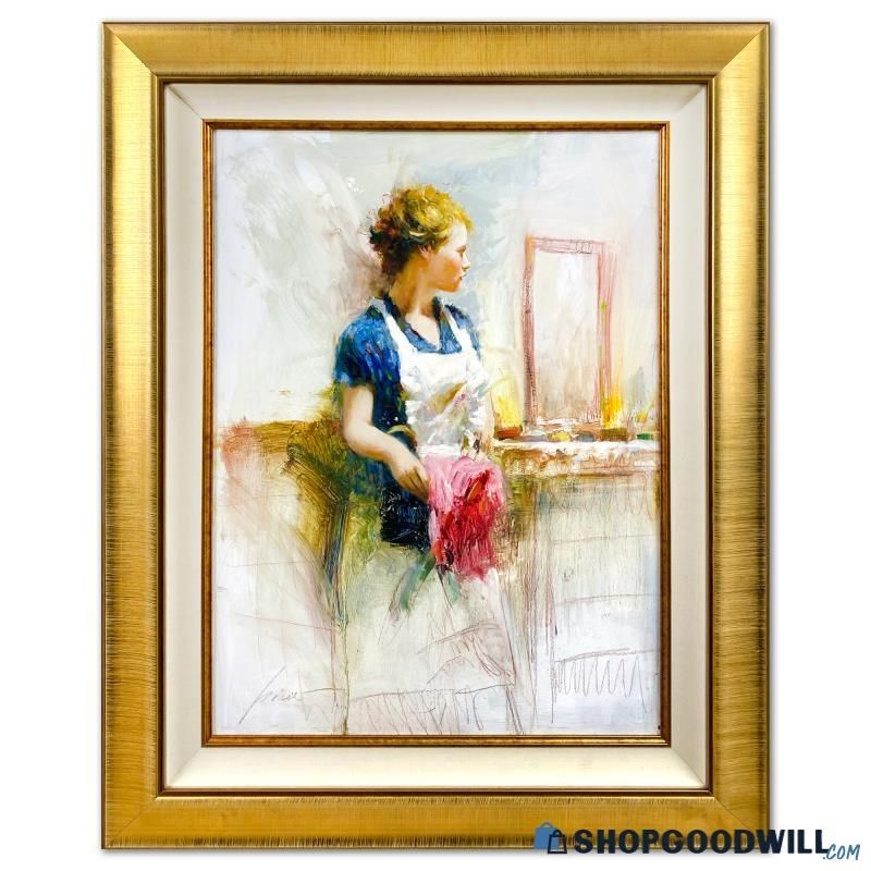A framed painting depicting a woman standing near a desk created in an impressionistic style