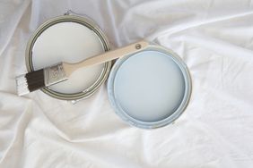 blue and white paint on a drop cloth